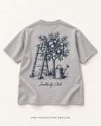 Generated pre-production flat lay preview of Garden Ladder Graphic Tee 102.